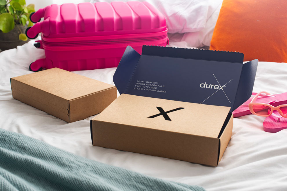 Durex gift box placed on a bed, holiday vibes