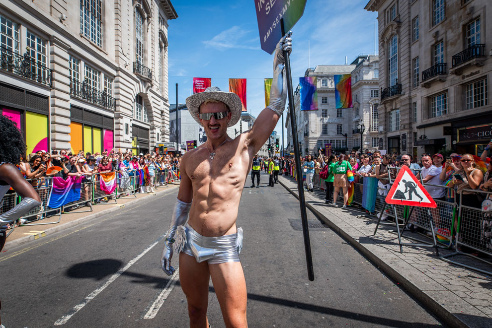 Parade performer at London Pride 2024 with a Durex sign
