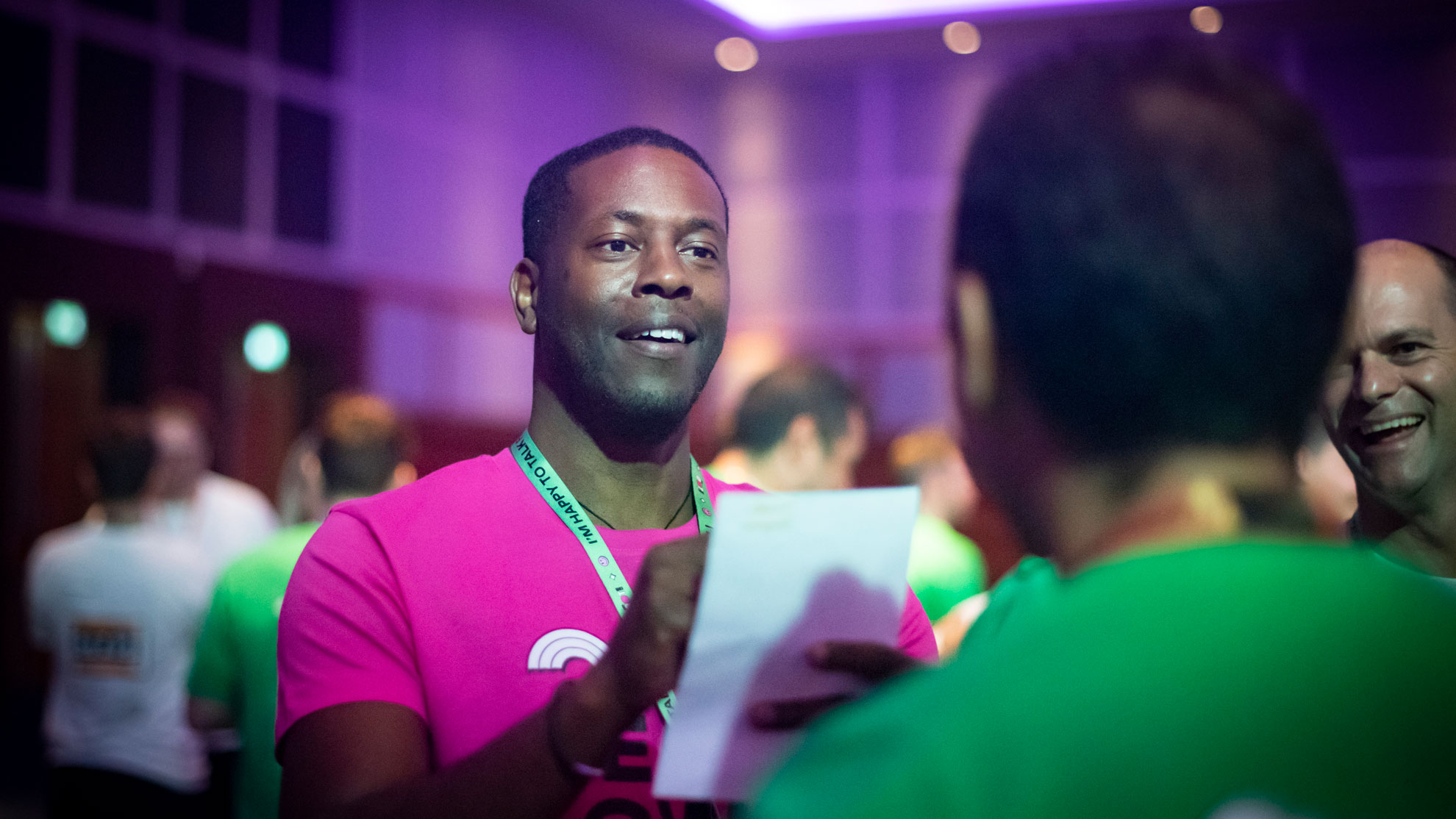 Conference attendee drawing a colleague as part of a team building exercise