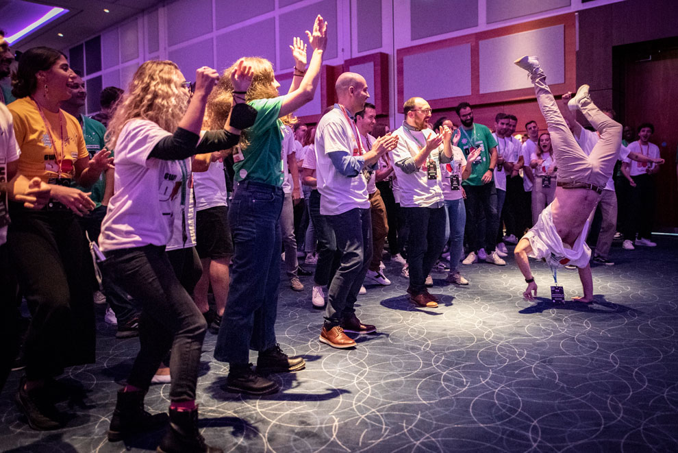 Group of conference attendees taking part in a team building exercise