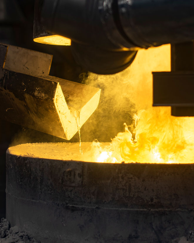 Molten metal pouring into a furnace