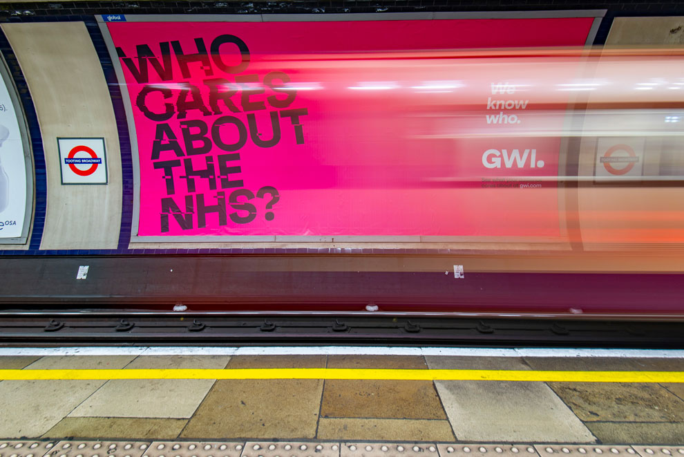 Advertising on the tube, a large billboard with a tube train rushing past.