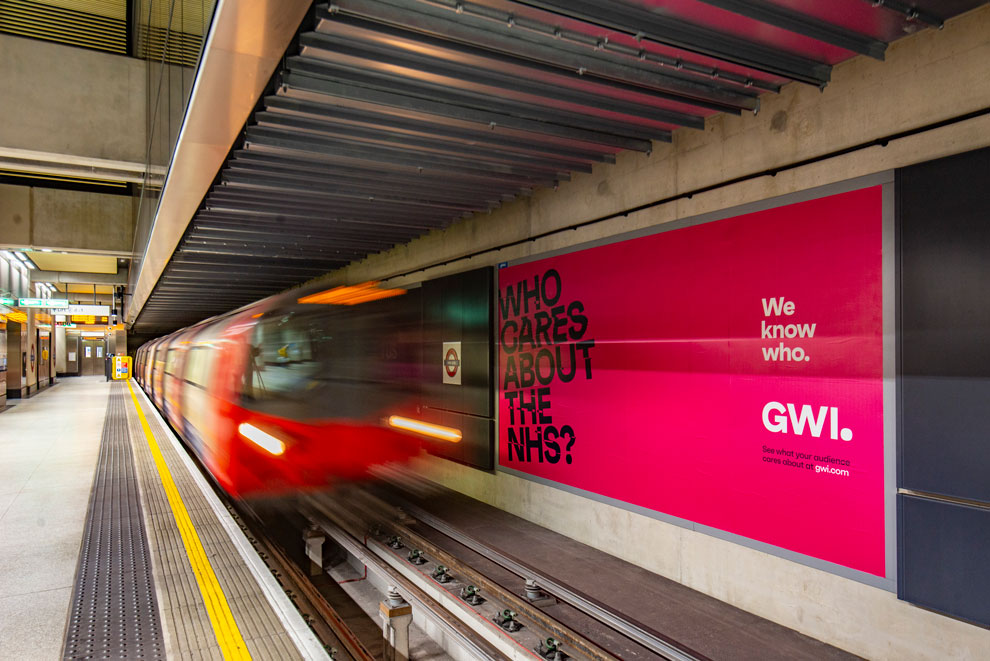 Advertising on the tube, a large billboard with a tube train rushing past.