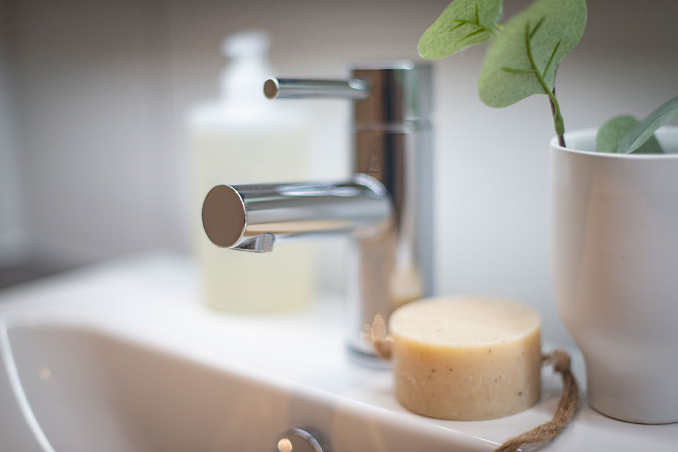 Close up of a stylish bathroom tap and soap