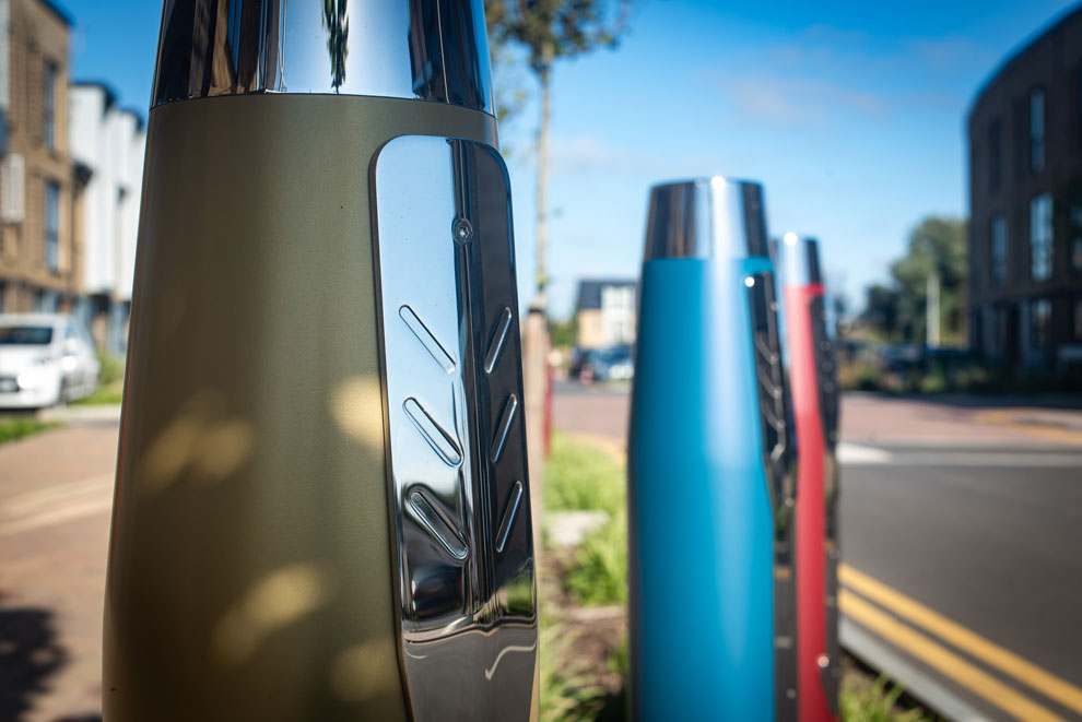 Roadside bollards at Safford Park styled as pen caps, reflecting the developments history
